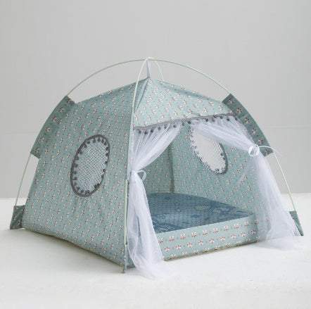 Green polka dot enclosed tent bed for pets with soft cushioned interior and pom-pom trim, ideal for cats and small dogs