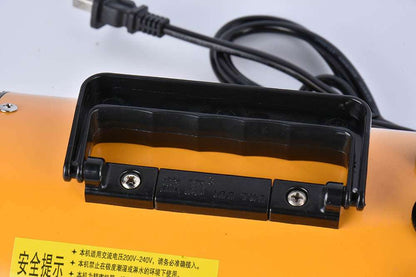 Pink metal dog hair dryer with black hose and four nozzle attachments on white background