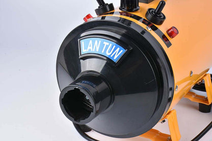 Pink metal dog hair dryer with black hose and four nozzle attachments on white background